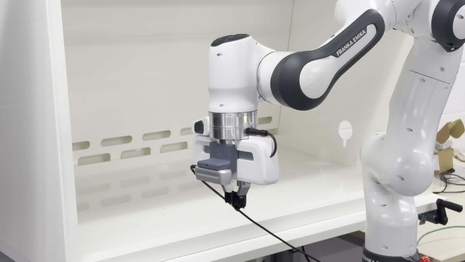 Robot removing a broken glass fragment